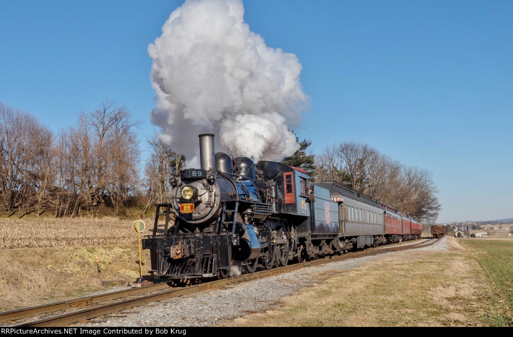Strasburg Railroad 2-6-0 steam locomotive #89 pulls a 5-car train set through Cherry Hill on the return leg of the excursion.